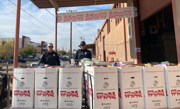 Police Officers with 7 boxes full of donated toys