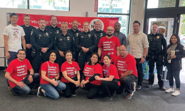 ESPD CLO team w community members in red shirts